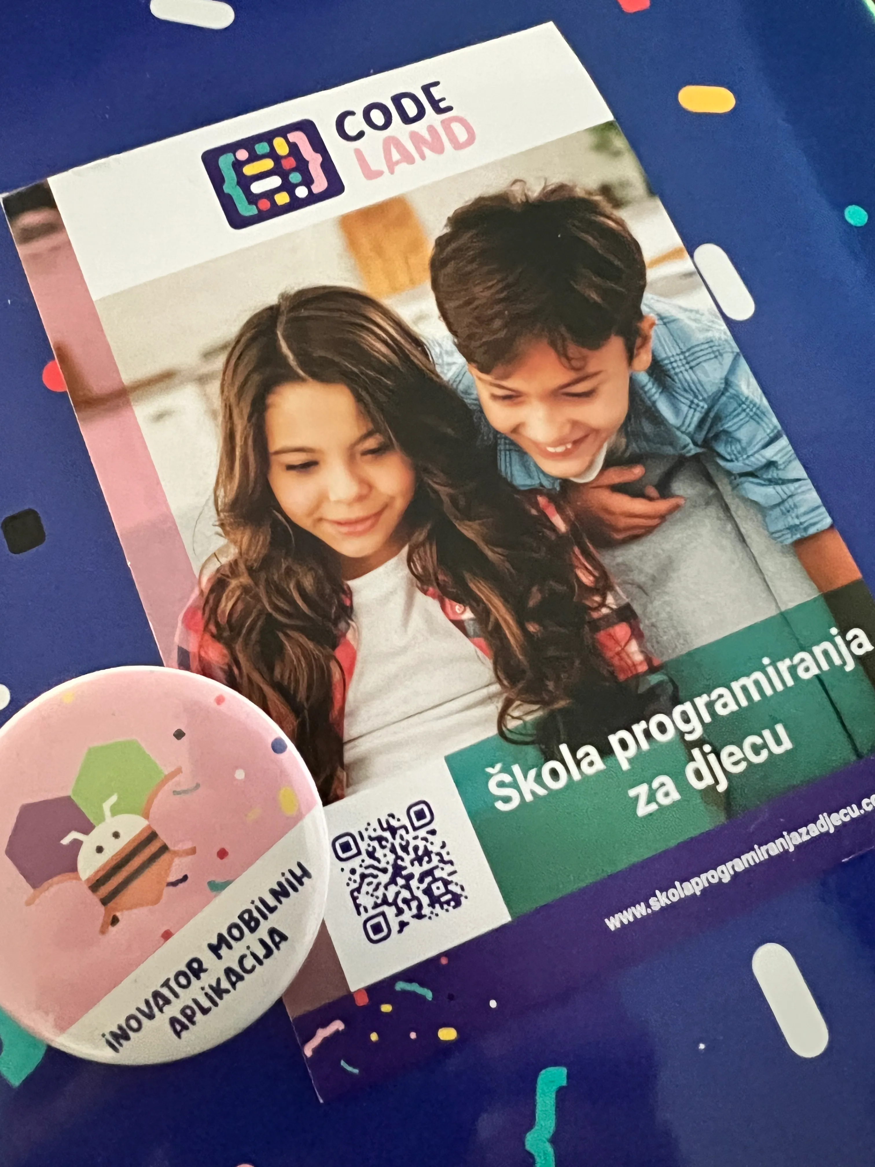 Child holding up ART letters